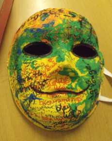 Yellow green painting mask, smiling, with words