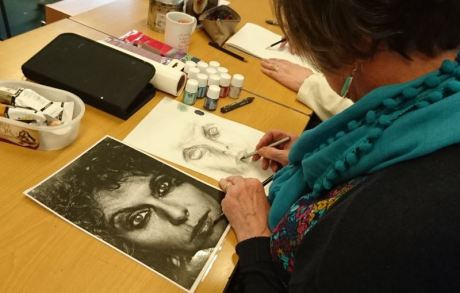 Woman drawing a portrait