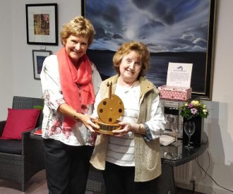Sandra White, right, receives the Gordon Crisell Shield from Angela Wood